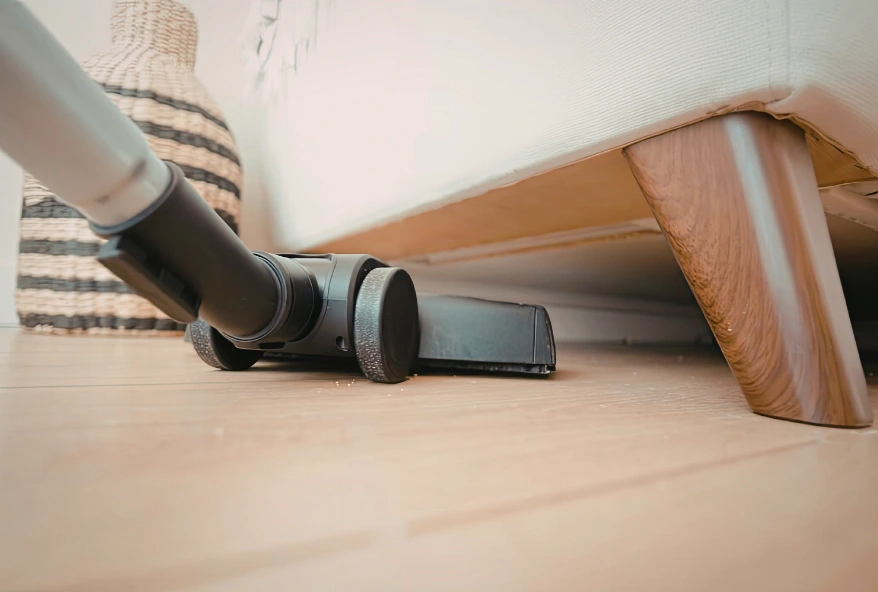 deep cleaning services Dubai vacuuming under sofa